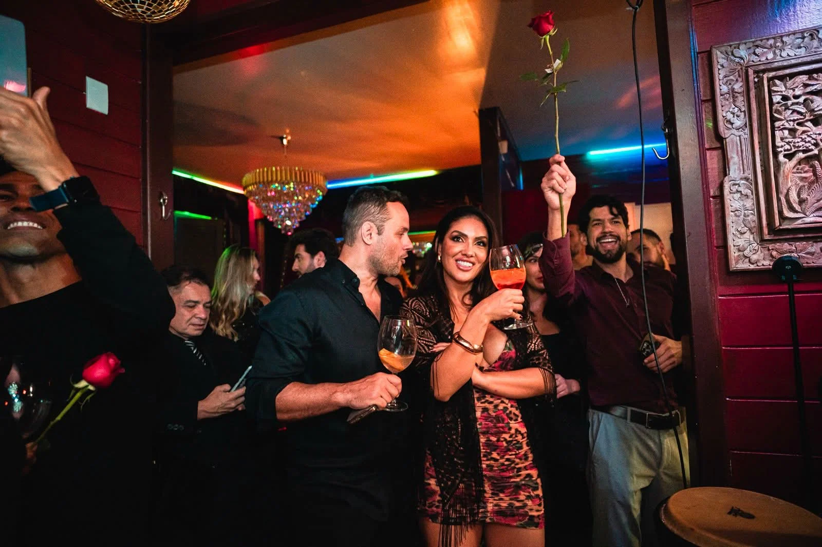 A toast with a rose during a celebration at Cabaret Le Luxe