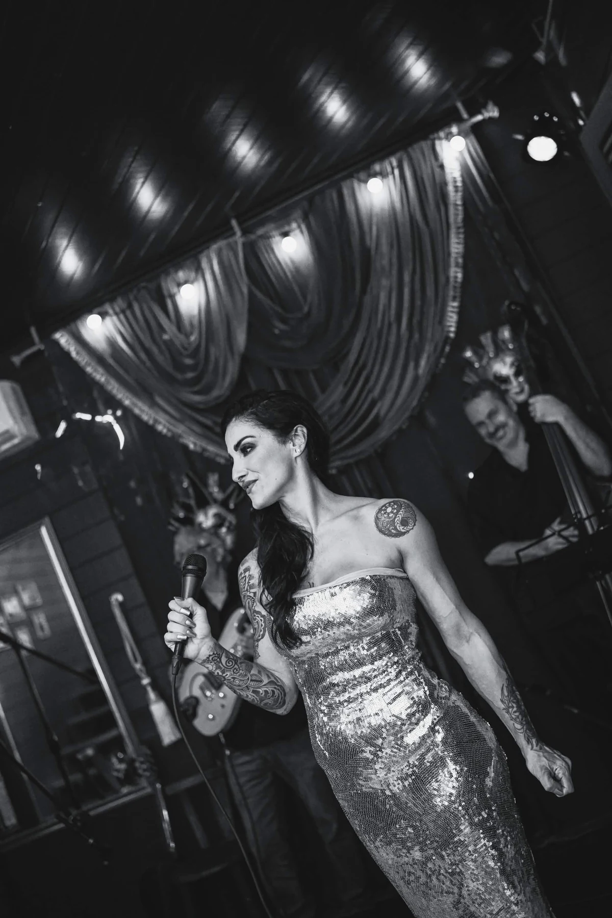 Singer performing on the Cabaret Le Luxe stage