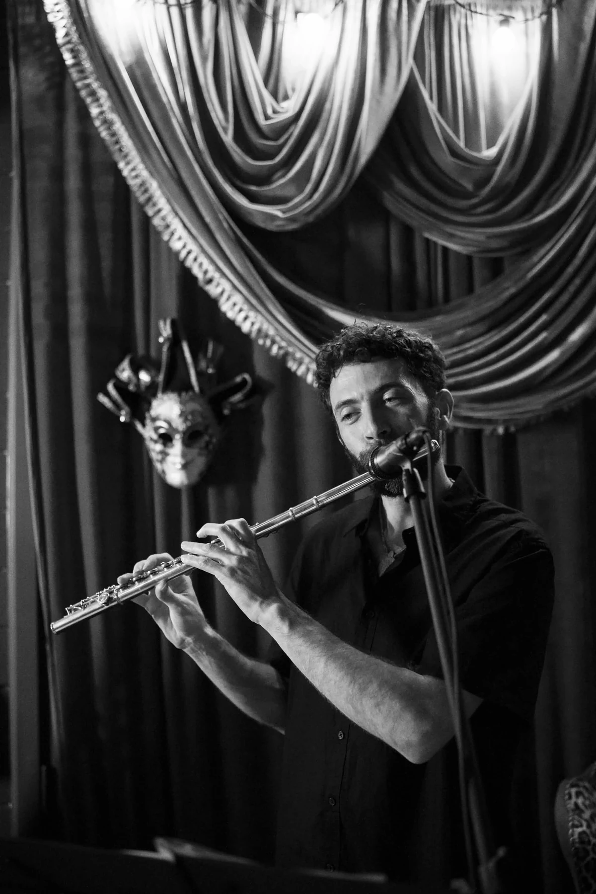Musician playing flute at Cabaret Le Luxe